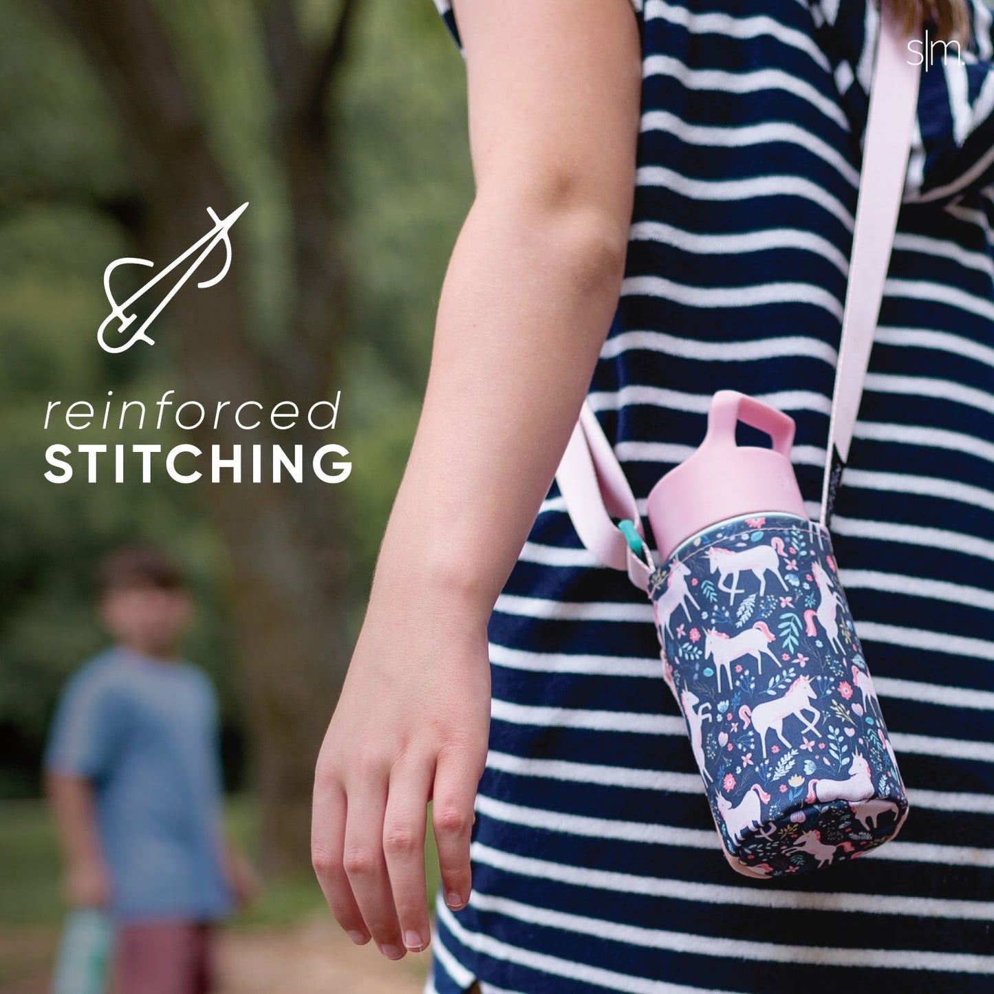 Child wearing navy blue and white striped shirt with dark navy bottle carrier sling across body