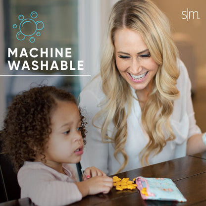 Woman and child holding Ellie Snack Bag against warm beige background, featuring blonde woman in light shirt and child with peachy skin tone in neutral cream and tan setting.