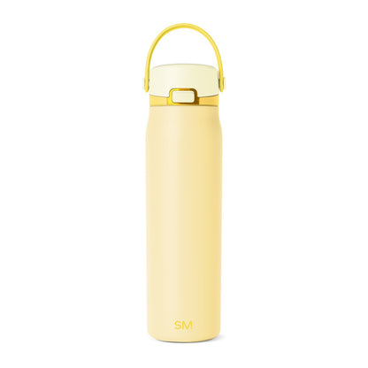 Soft pale yellow and buttercream-toned product with metallic gold and brass accents for added sophistication and visual contrast.