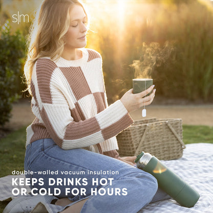 Woman wearing a cream-colored knit sweater bathed in warm golden-hour sunlight, creating soft amber and beige tones in a cozy, minimalist aesthetic.